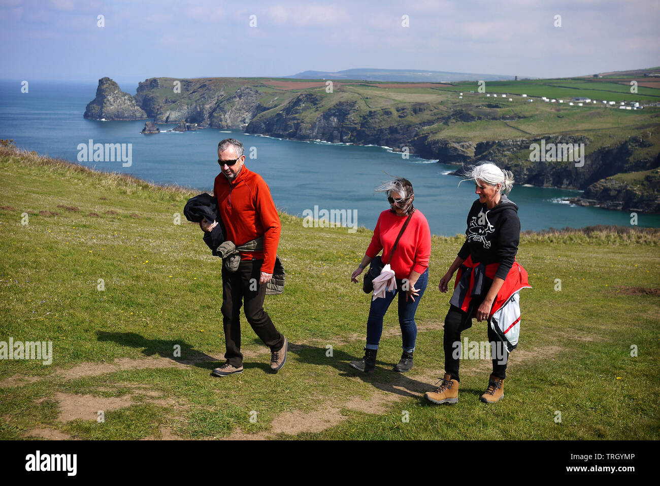Walkers on the South West Coast Path between Boscastle and Tintagel in Cornwall, UK. Stock Photo
