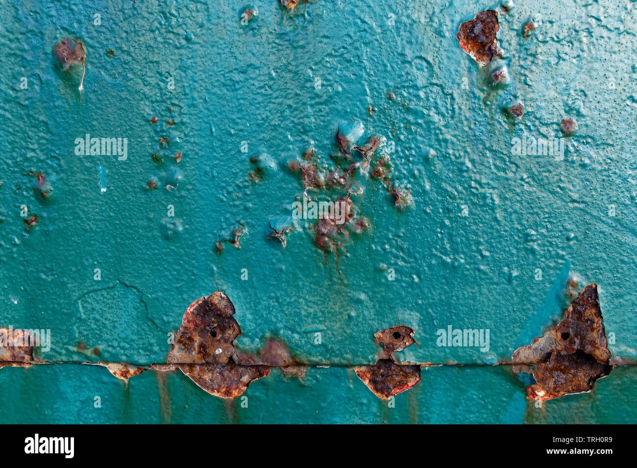Bubbles in paint work as rust works on the metal underneath Stock Photo