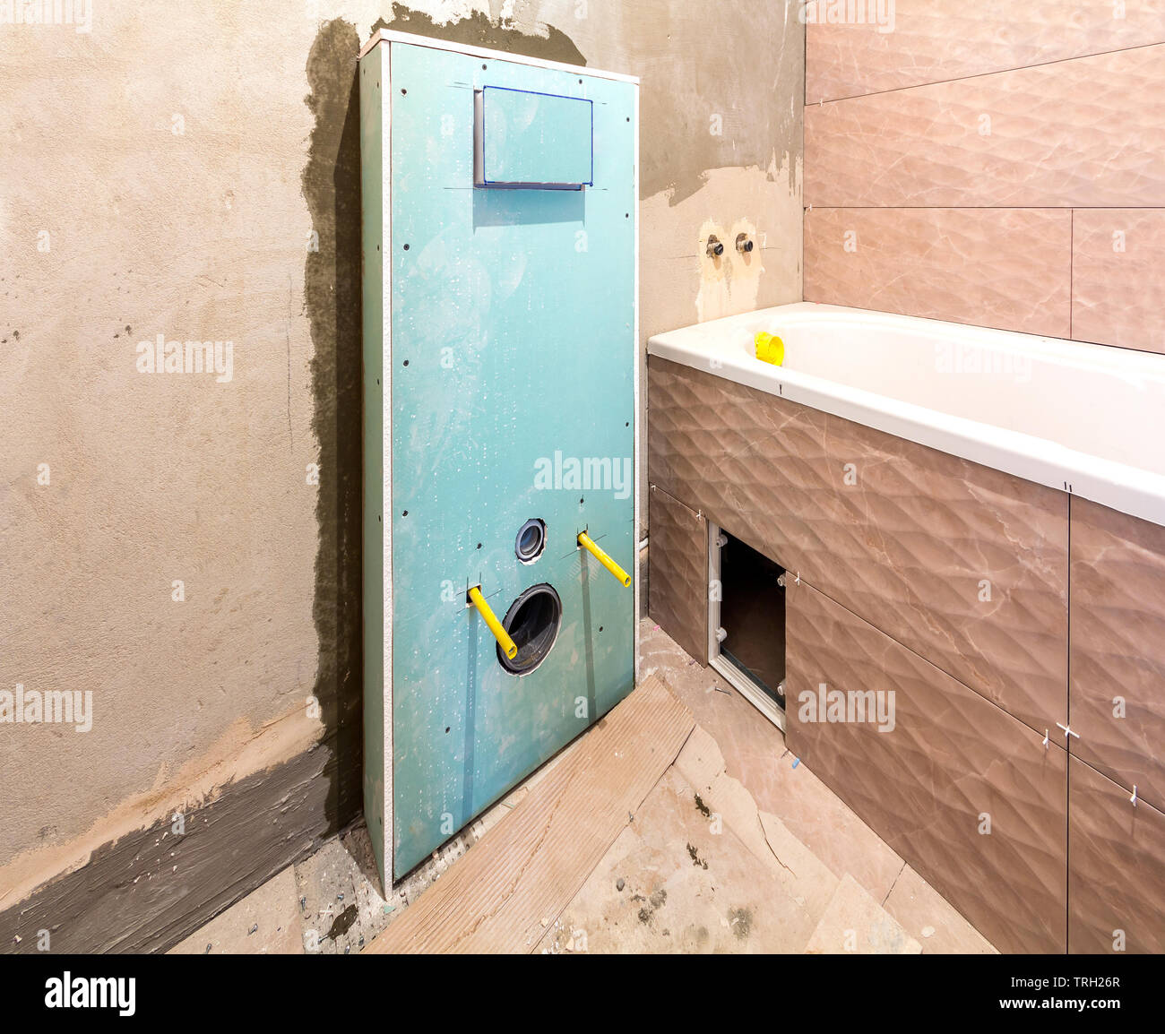 Unfinished reconstruction of bathroom or toilet with ceramic tiles
