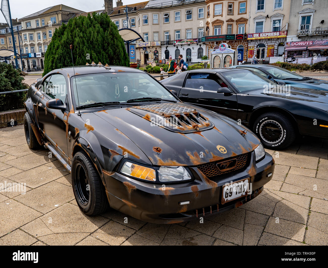 Modified Ford Mustang made to look old and rusty parked up on Great Yarmouth seafront Stock Photo