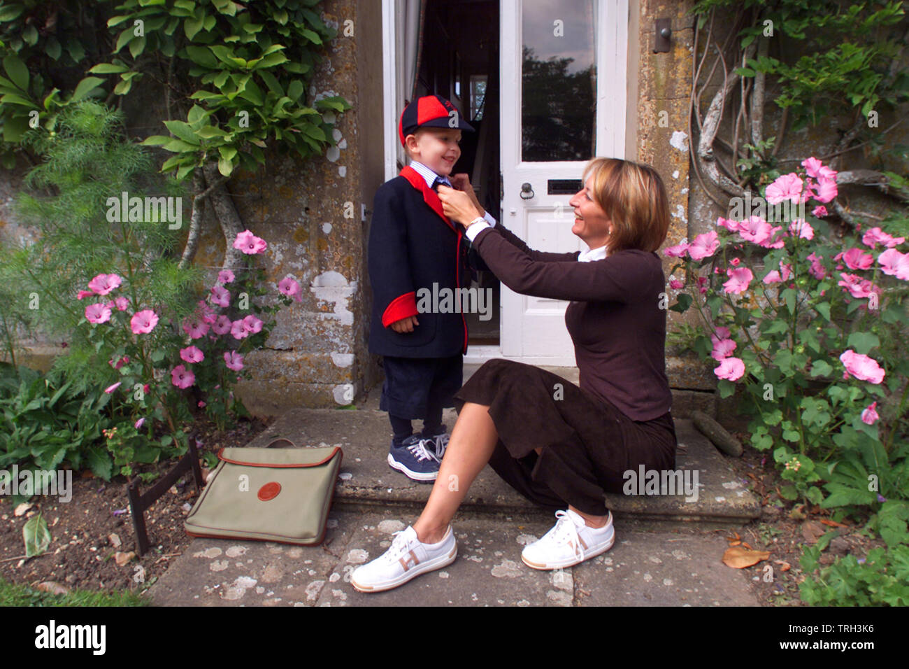 27.08.2002 - Jasper Cable-Alexander prepares for school with mum Melanie. Stock Photo