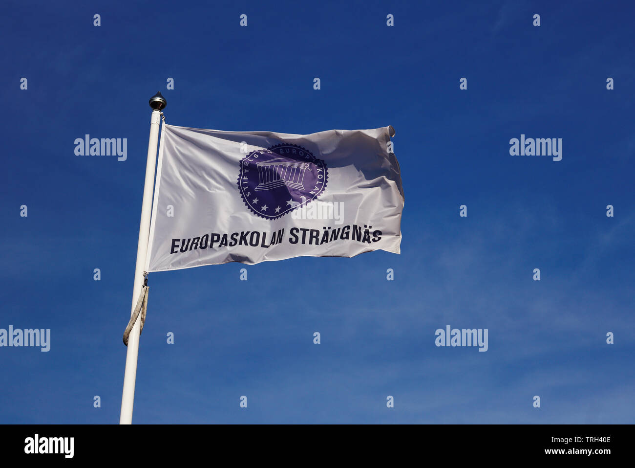 Strangnas, Sweden - June 5, 2019: Close-up of the Europaskolan school flag against the blue sky. Stock Photo