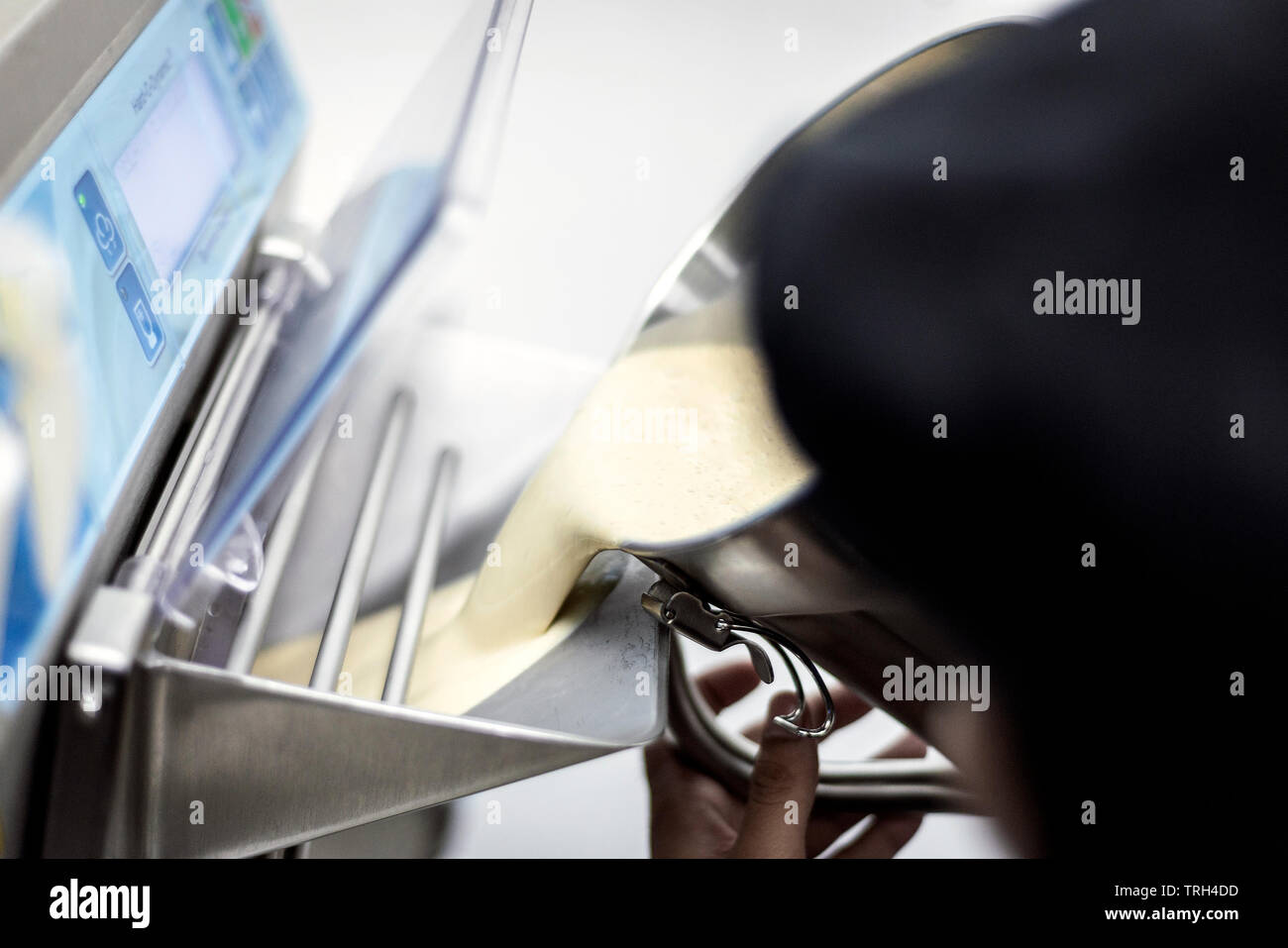 making gelato ice cream with modern professional equipment preparation