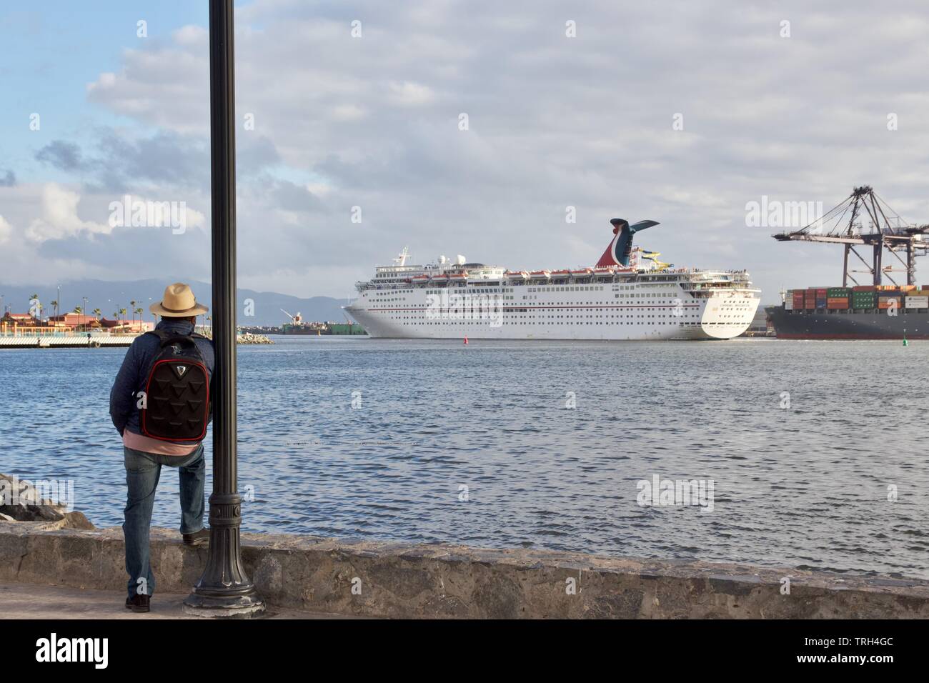 A Man Looking At A Cruise Ship At The Port Of Ensenada Baja California Mexico Stock Photo Alamy