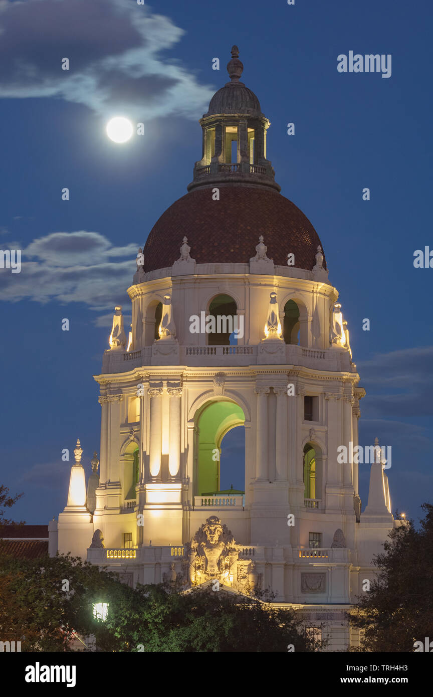 The beautiful Pasadena City Hall shown against a twilight sky and rising full moon. Pasadena is located in the Los Angeles County in California. Stock Photo