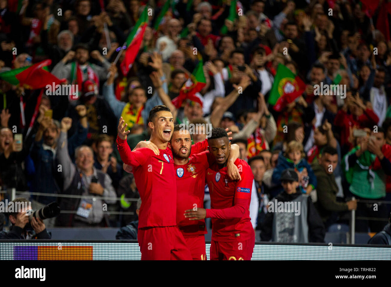 Portugal's player Cristiano Ronaldo (R), Bernardo Silva and Nélson Semedo is seen celebrating the second goal during the match for the UEFA Nations League Finals at Dragon Stadium on 5 June, 2019 in Porto, Portugal. ( Final score; Portugal 3:1 Switzerland ) Stock Photo
