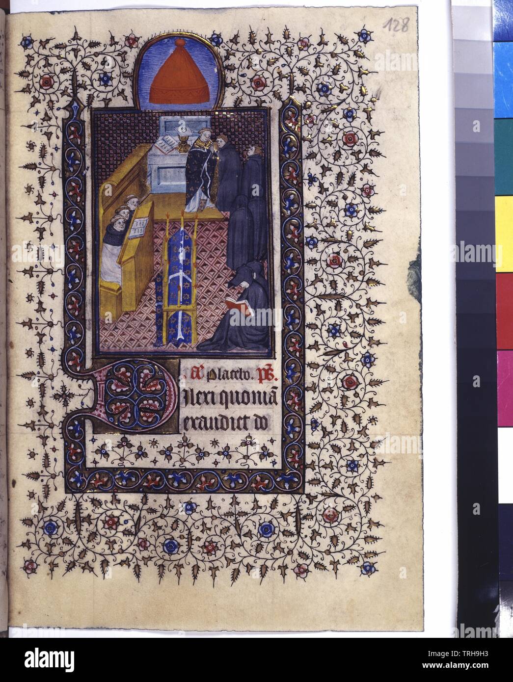 full page: text, covering colour initial on golden ground, miniature (requiem = monk in the choir stalls, parish priest at altar with monks, Pleurants and lay out coffin), moulding and tendrils border, Additional-Rights-Clearance-Info-Not-Available Stock Photo