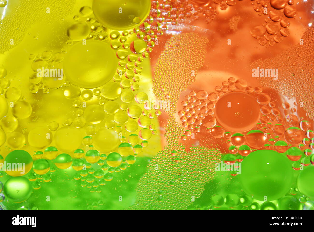 oil bubble floating on water surface in colorful background Stock Photo