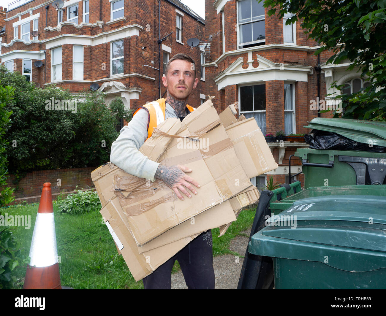 male council worker recycling brown cardboard boxes Stock Photo Alamy