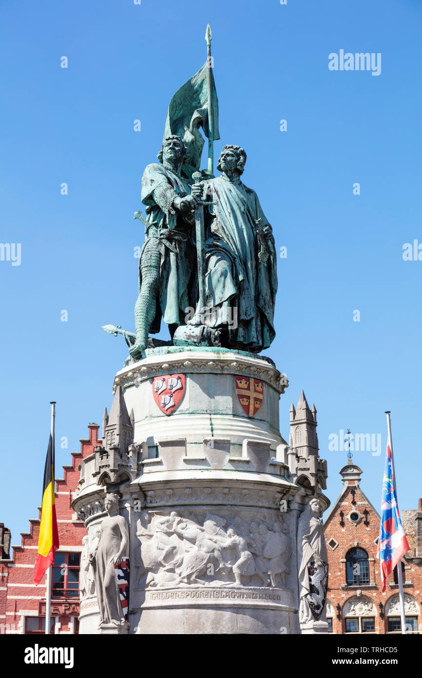 The bronze statue of the medieval heroes Jan breydal and pieter de coninck in the historic market square Markt Bruges Belgium EU Europe Stock Photo