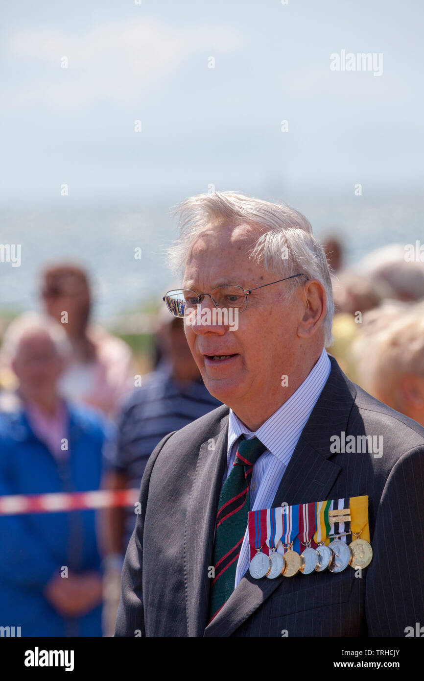 HRH The Duke of Gloucester at the  D Day Commemoration at the COPP (Combined Operation Pilotage Parties) Memorial on the seafront on Hayling Island.  On 2 May 1944, Hayling Island seafront was used for practice amphibious landings, known as Exercise Fabius 2.   The COPP Unit was set up on Hayling Island under the instruction of Lord Mountbatten in 1943.  The Memorial is dedicated to the soldiers who trained as frogmen and canoeists for beach reconnaissance and other covert operations prior to the Allied landings on enemy occupied territory. Stock Photo