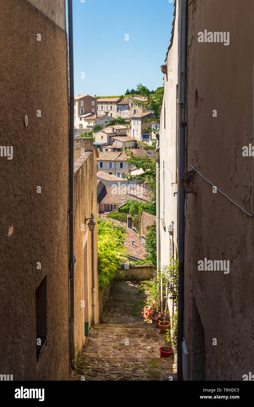 Saint-Emilion (Gironde, France), narrow alley and view oevr the village Stock Photo
