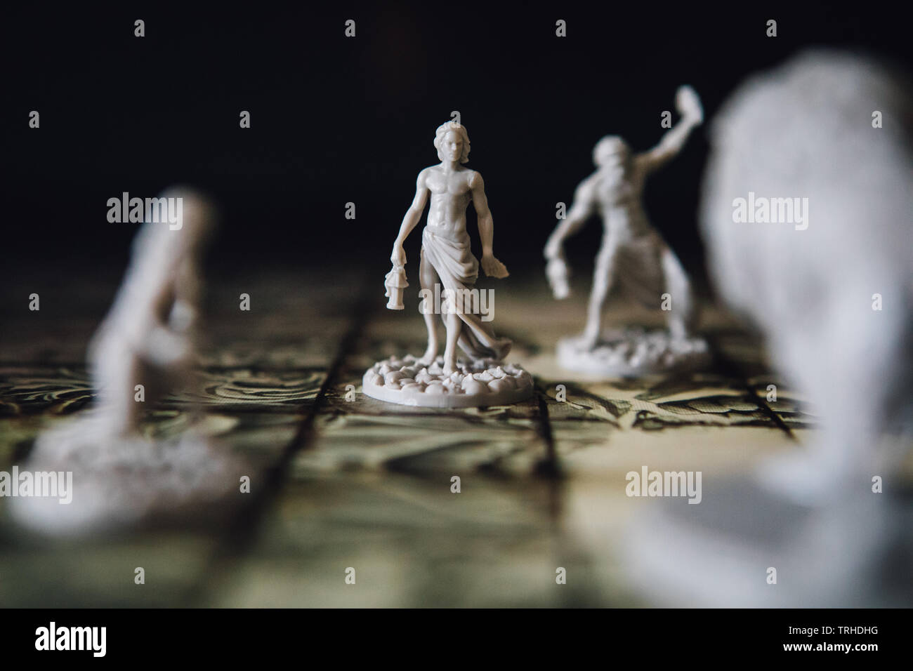 Miniatures in the board game Kingdom Death Monster by Adam Poots Stock