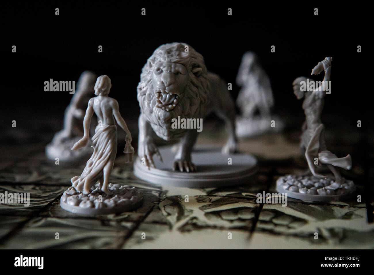 Miniatures in the board game Kingdom Death Monster by Adam Poots Stock