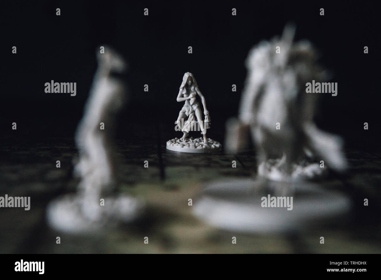 Miniatures in the board game Kingdom Death Monster by Adam Poots Stock