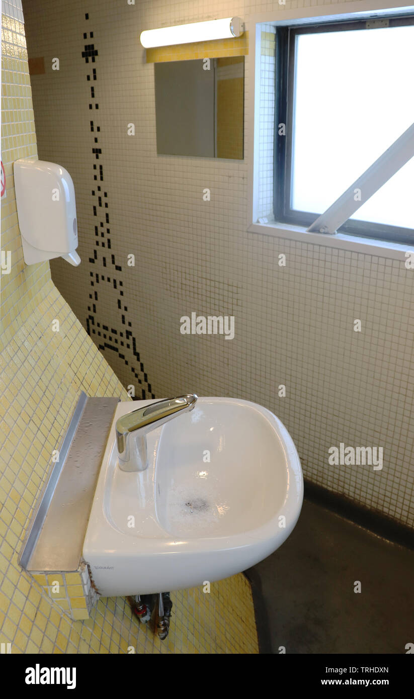 Entering the bathroom at the top of the Eiffel Tower in Paris, France