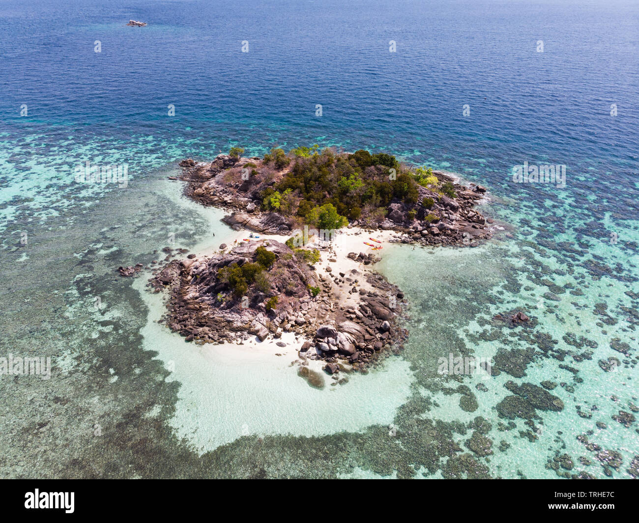 Aerial view of island with coral reef in tropical sea Stock Photo - Alamy