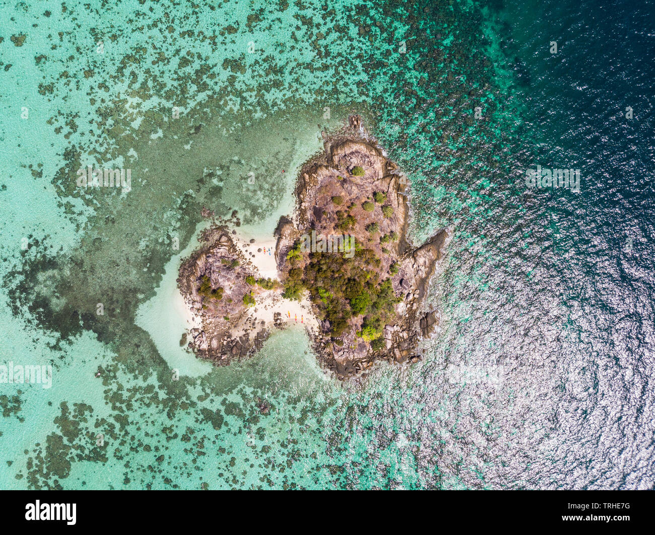 Aerial view of island with coral reef in tropical sea Stock Photo - Alamy