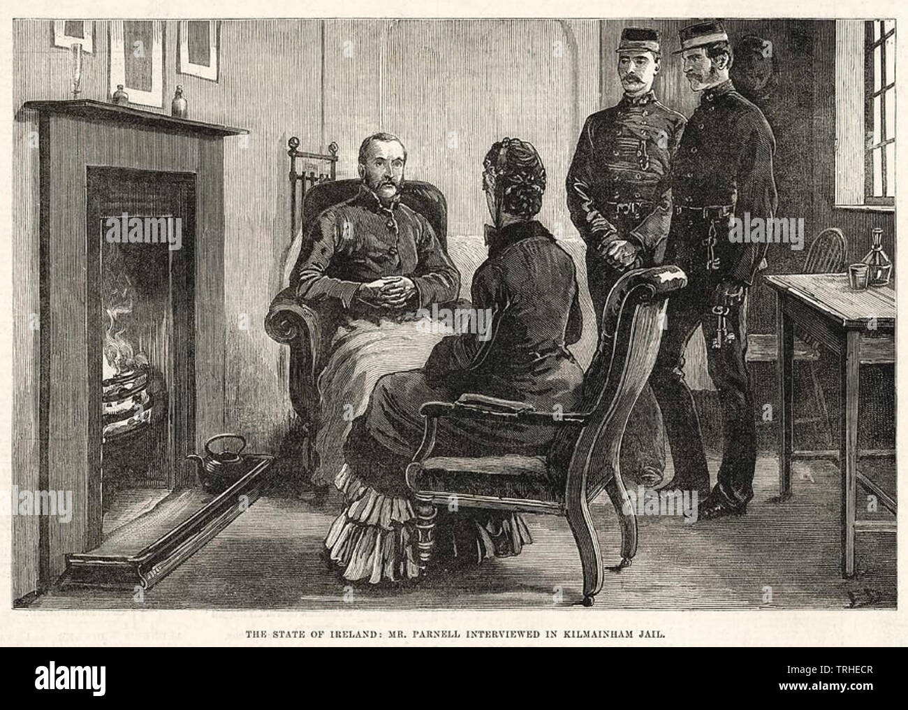 CHARLES STEWART PARNELL (1846-1891)  Ir9sh nationalist politician receiving a visitor in his cell in Kilmainham Gaol in 1881watched by two warders Stock Photo