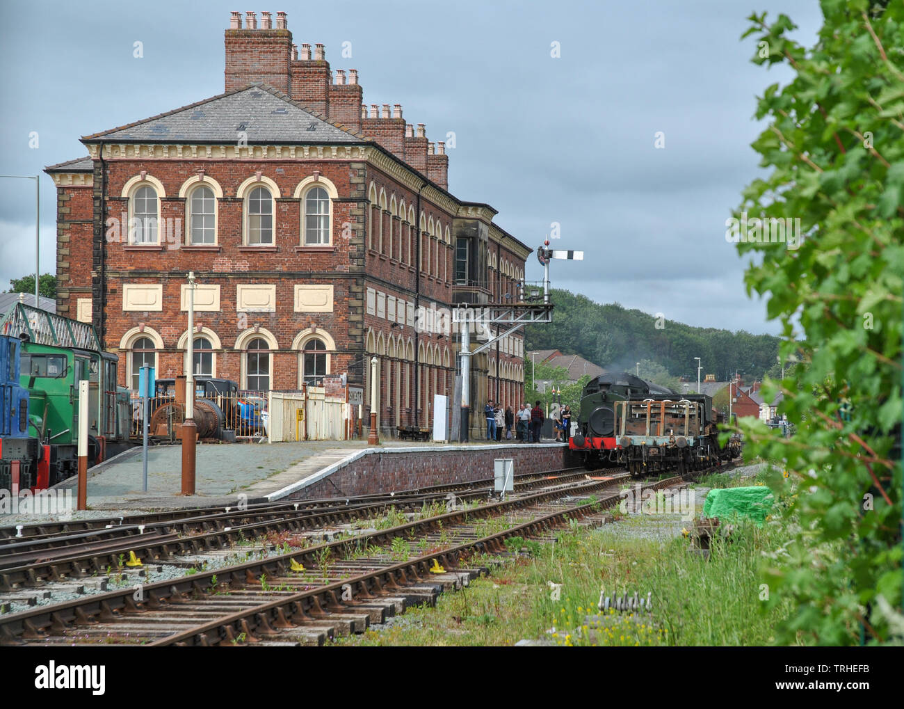 Oswestry Station building showing passengers departing on to the