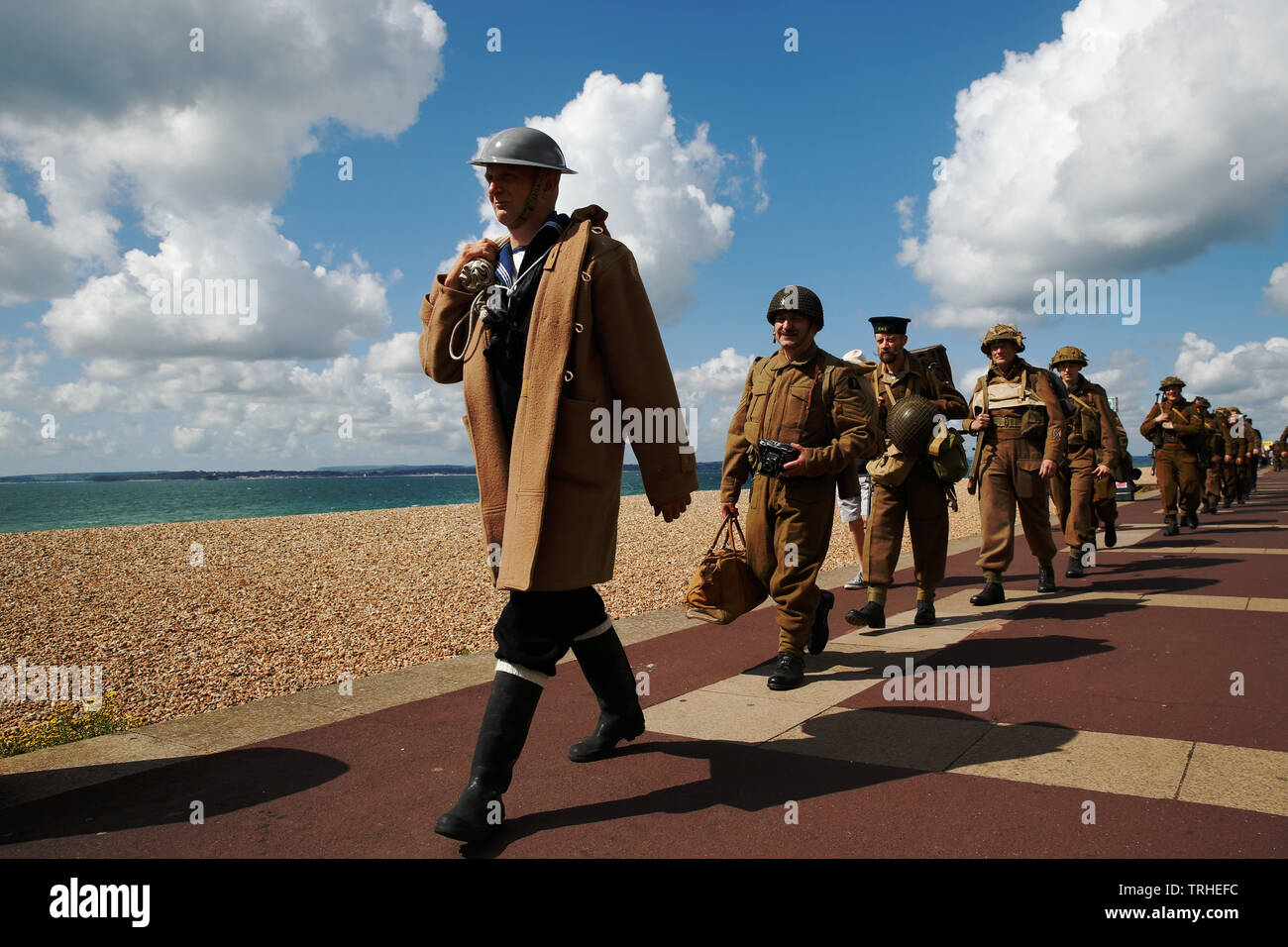 Portsmouth, UK. 6th June, 2019. World War II re-enactors walk the original route of the d-day soldiers took through Portsmouth to the landing craft, in Southsea, Portmsouth Thursday June 6, 2019. D-day commemorations marking the 75th anniversary of the d-day landings Photograph : Credit: Luke MacGregor/Alamy Live News Stock Photo