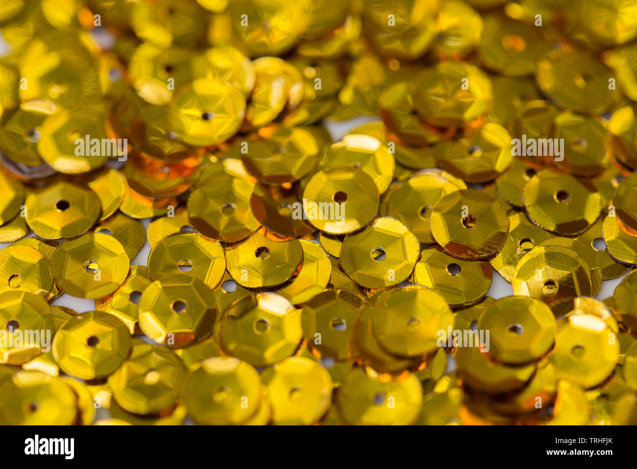 golden color sequins macro background Stock Photo