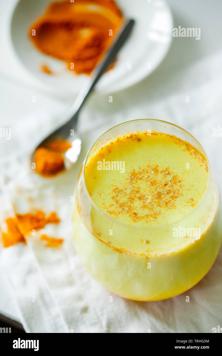 Healthy ayurvedic drink golden almond milk or pumpkin turmeric latte