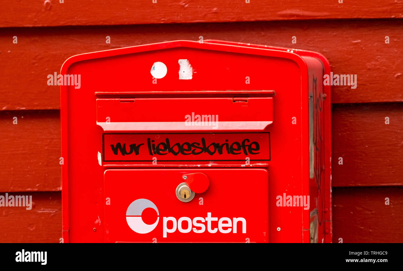 red Norwegian letterbox for love letters at wooden house in Bryggen, only for love letters, Bergen, Hordaland, Norway, Scandinavia, Europe, NOR, trave Stock Photo