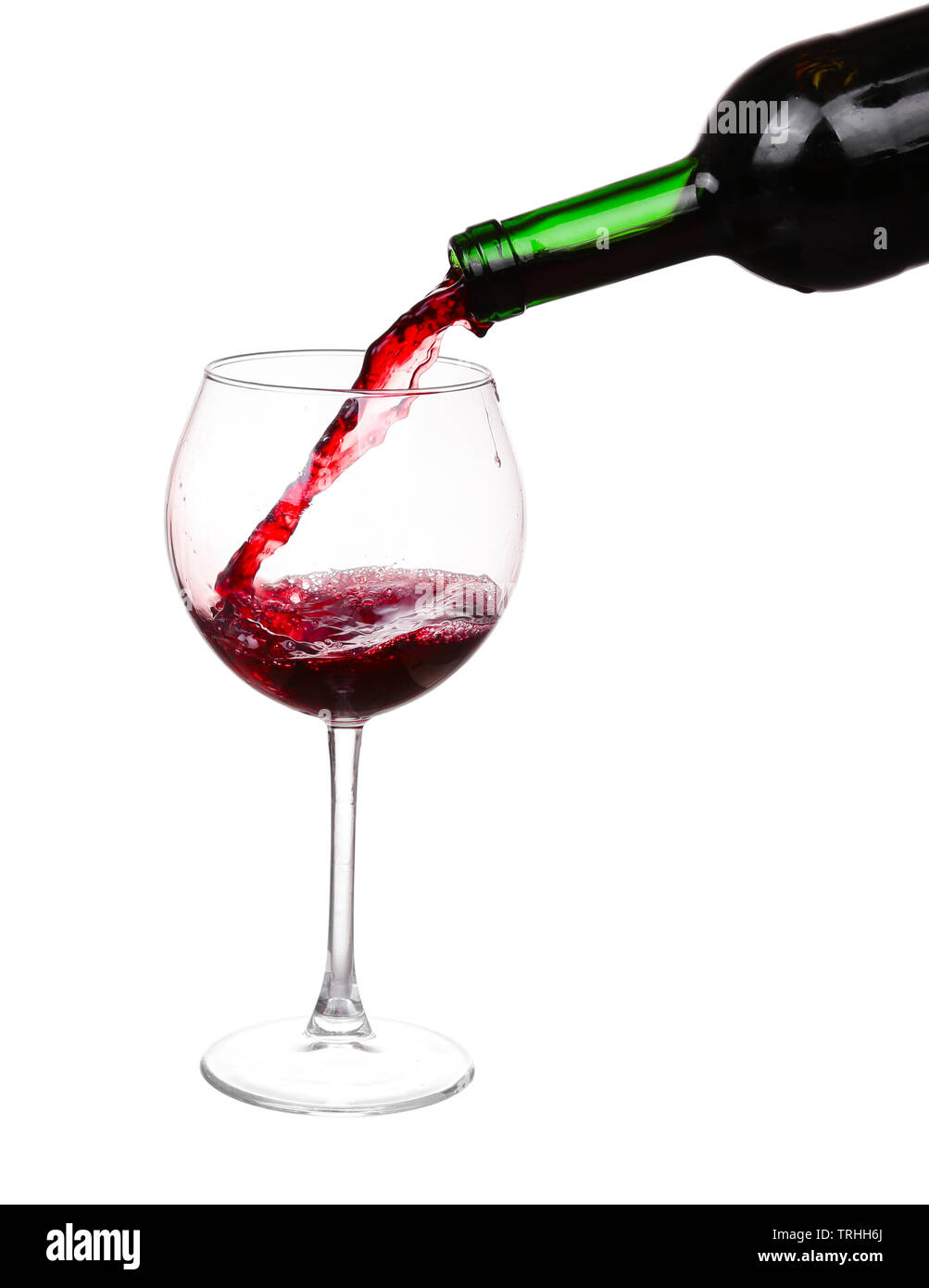 Red wine pouring on white background Stock Photo