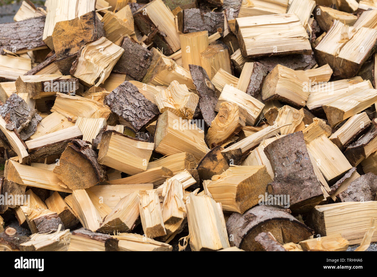 Isolated view on chopped wood. Piled in an unsorted way, looking quite chaotic. Ready to be set on fire. Stock Photo