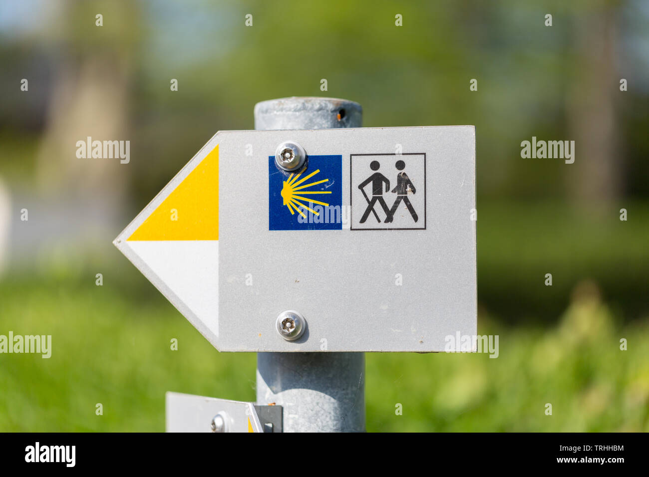 Sign showing the way to Santiago de Compostela. The Camino de Santiago is a network of pilgrims' ways leading to the shrine of the apostle Saint James Stock Photo