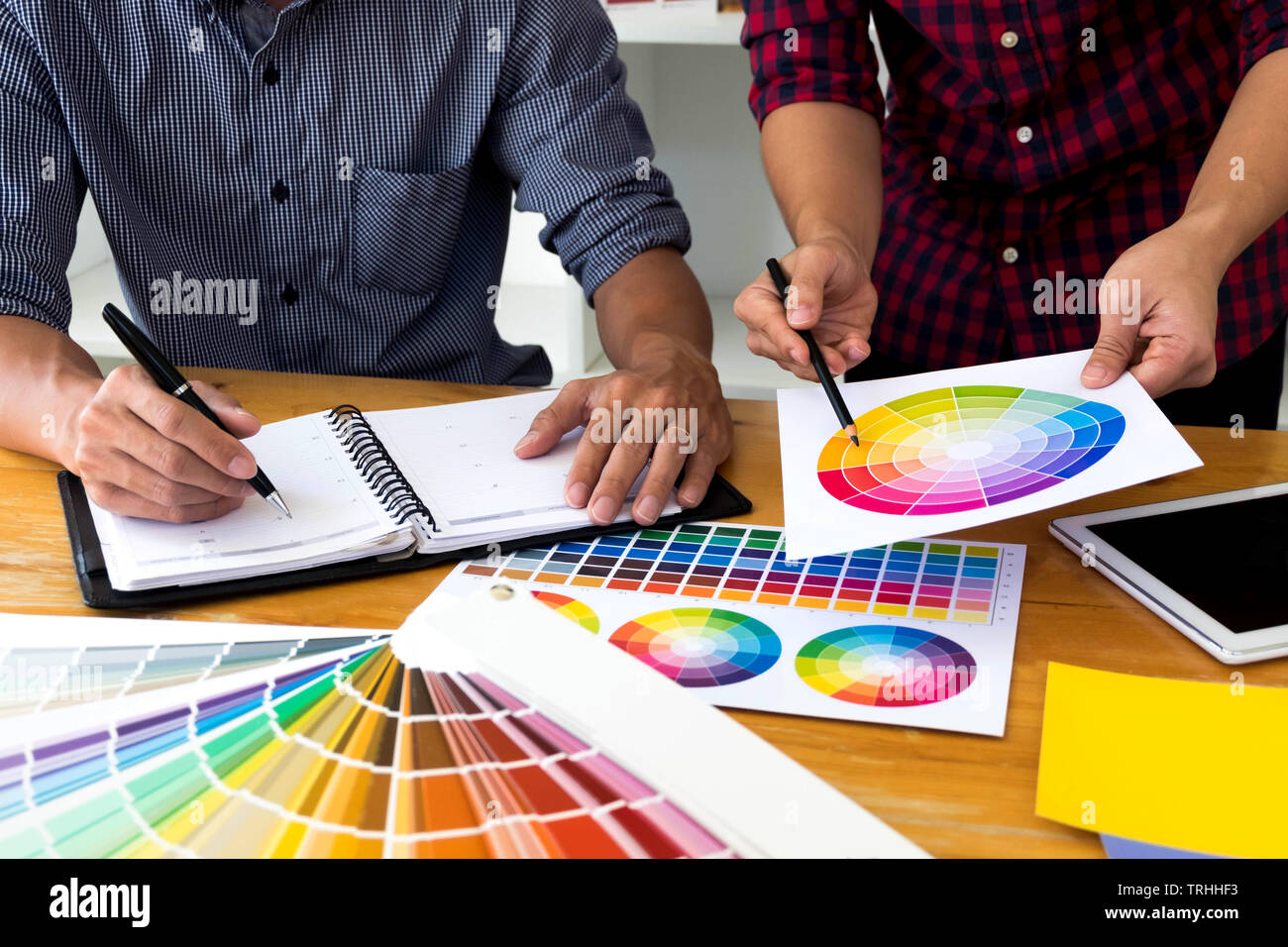 Graphic designers choose colors from the color bands samples for design