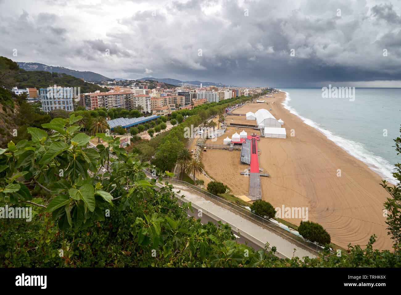 Calella beach, Spain, view from lighthouse, dark clouds, rainy, nature, europe, party. Stock Photo