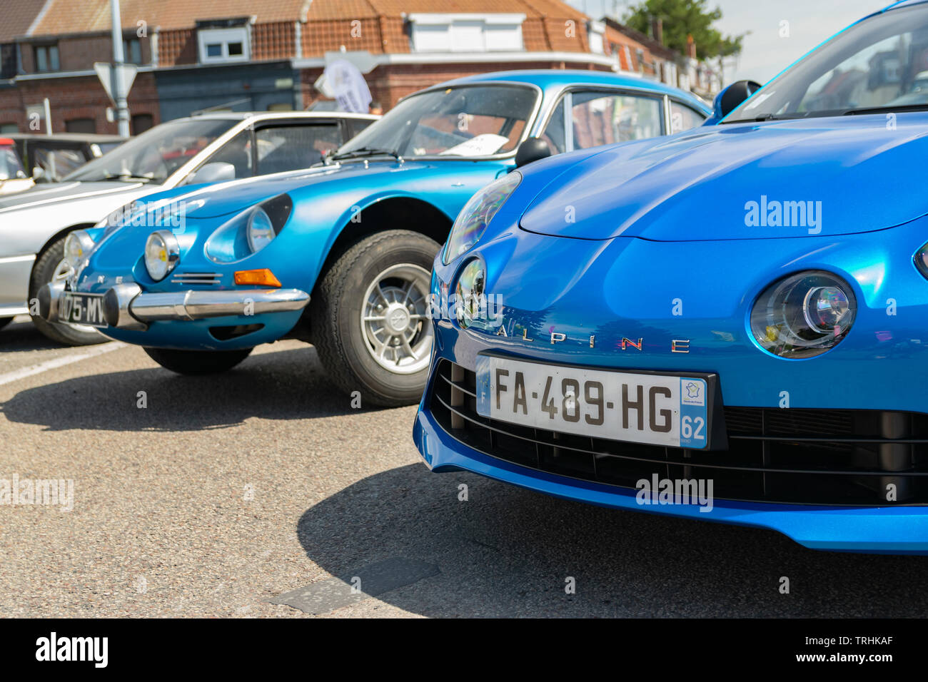Wattrelos,FRANCE-June 02,2019: blue new and old  Renault Alpine A110,front view,car exhibited at the Renault Wattrelos Martinoire parking lot. Stock Photo