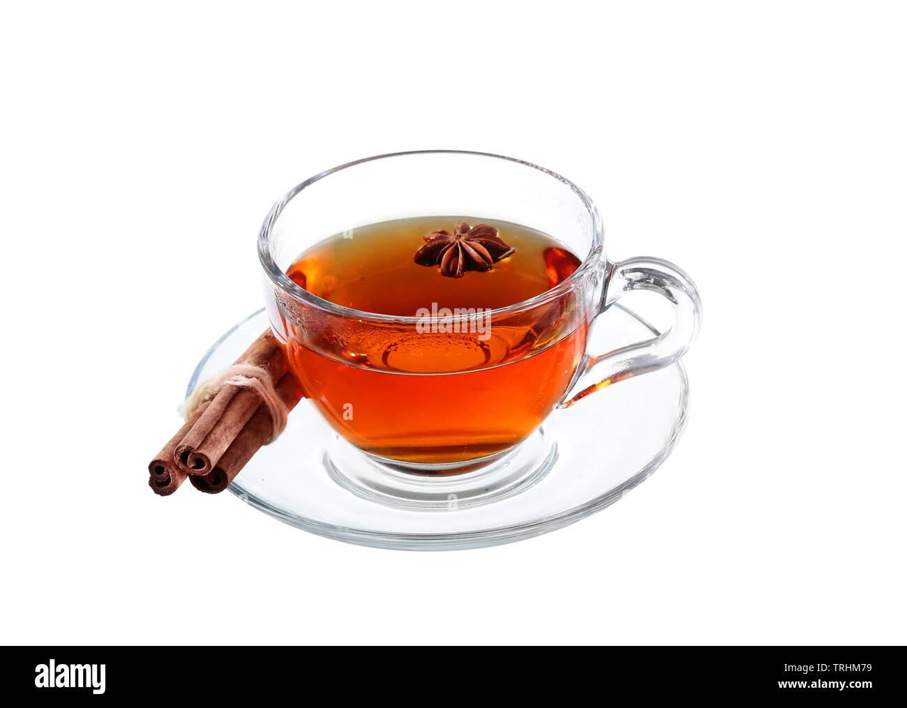 Delicious tea with spices in glass cup isolated on white background ...