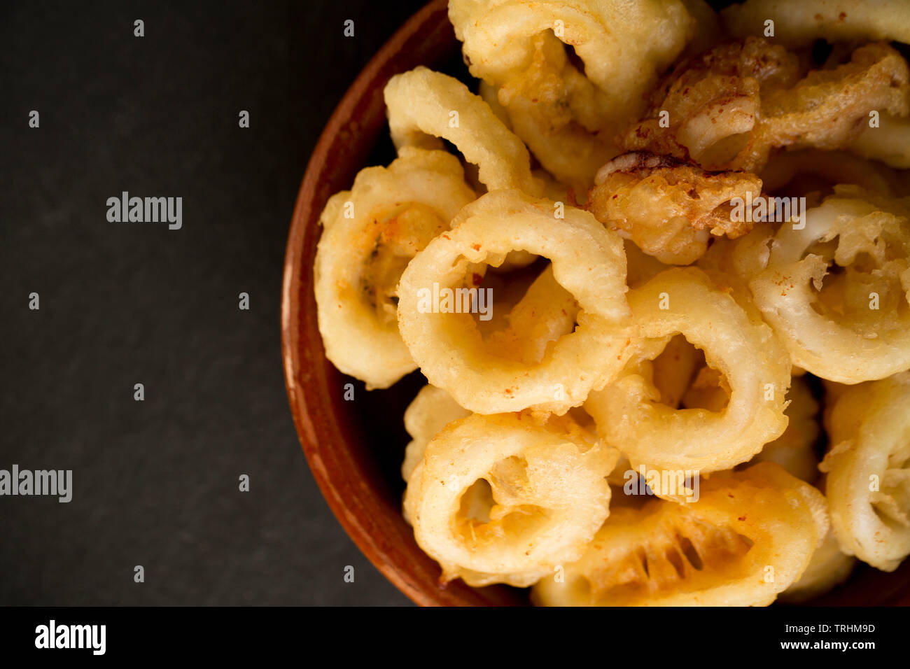 Deep fried, battered squid rings and tentacles from a Loligo vulgaris squid that was caught on rod and line in the English Channel. Dorset England UK Stock Photo