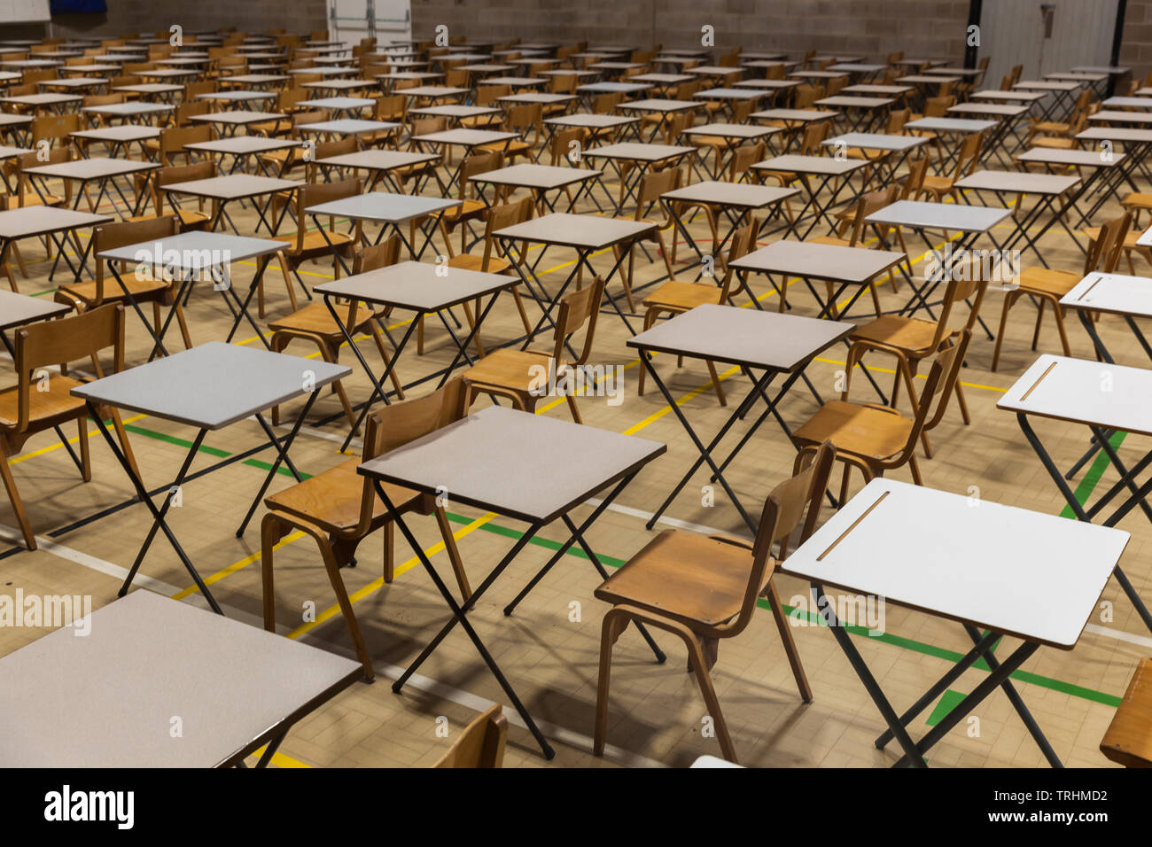 Exam tables and chairs set up in a UK school. Stock Photo