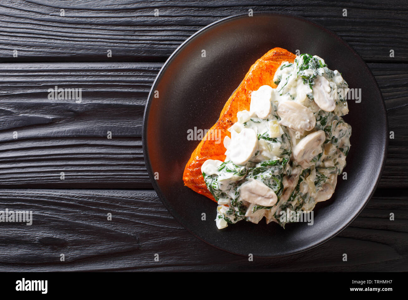 Baked Florentine salmon with creamy wine sauce, seasoned with roasted