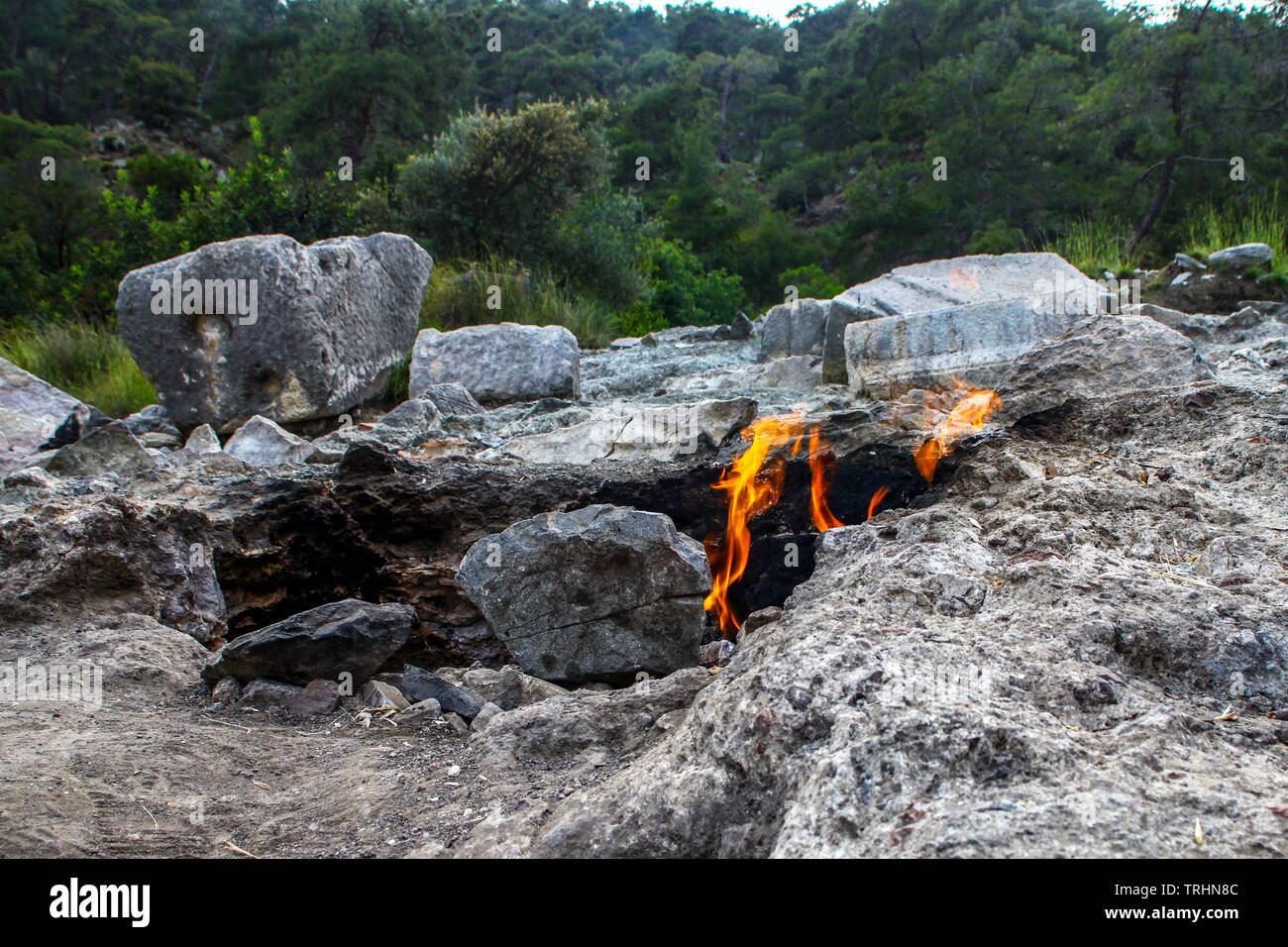 Yanartas burning stones is a geographical feature near the Olympos valley and national park in Antalya Province in southwestern Turkey Stock Photo