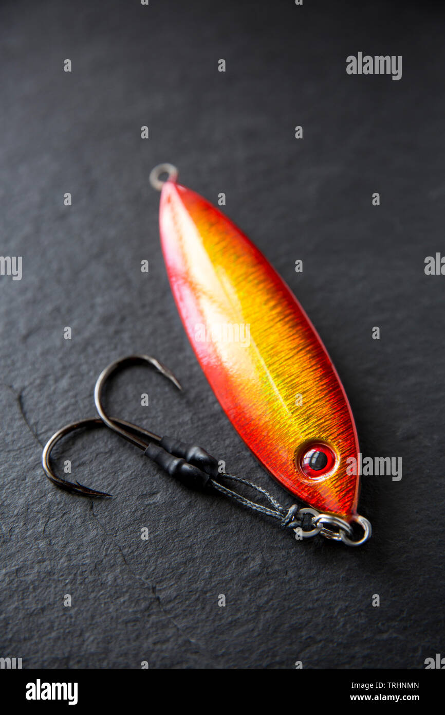A metal HTO Osoi fishing lure. Lures such as these are used normally for sea fishing from a boat when drifting over wrecks and reefs to catch such fis Stock Photo