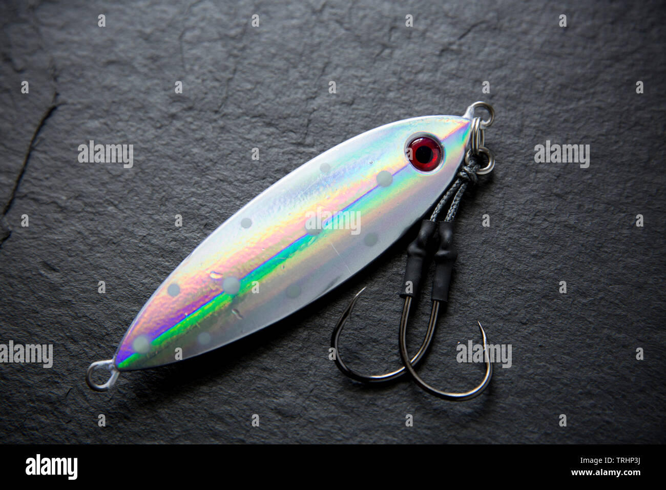A metal HTO Osoi fishing lure. Lures such as these are used normally for sea fishing from a boat when drifting over wrecks and reefs to catch such fis Stock Photo