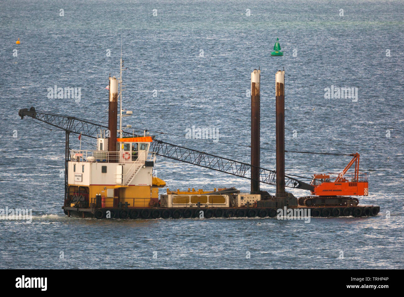 Barge,floating,crane,piles,satbilisers,stabilised,floating,Cowes, isle of Wight, England, UK, Stock Photo