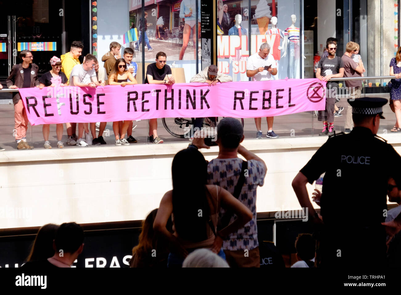 Campaigners from Extinction Rebellion disrupted the Bristol shopping areas of Broadmead and Cabot circus to highlight the impact disposable fashion ma Stock Photo