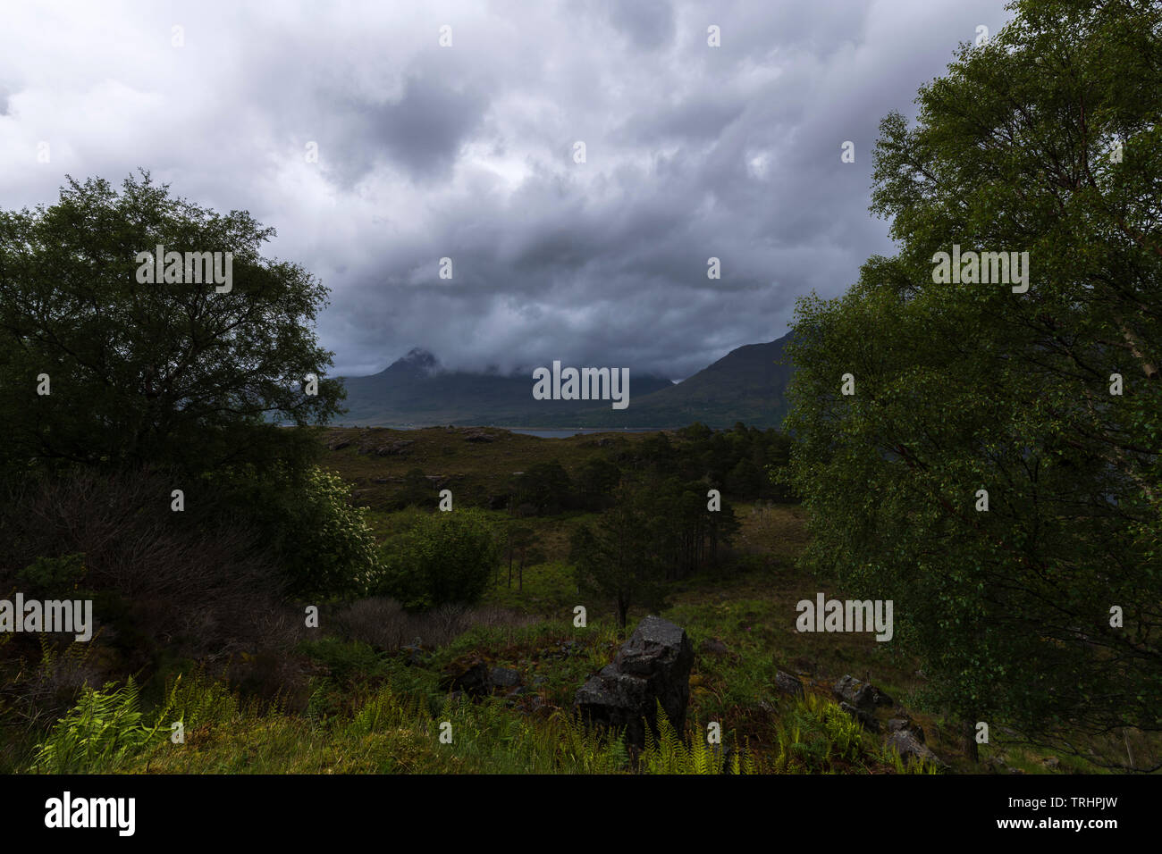 Heavy cloud and rain over Ben Alligin near Torridon on a summers day in the Scottish Highlands. 01 June 2019 Stock Photo