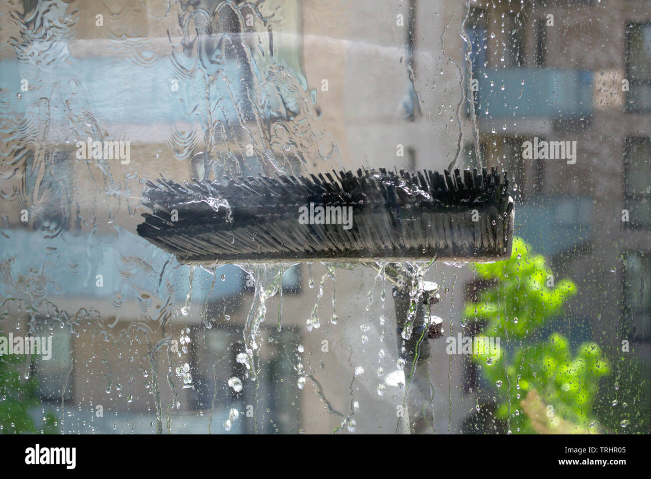 Window glass cleaning with pure water and extension pole. Washing and