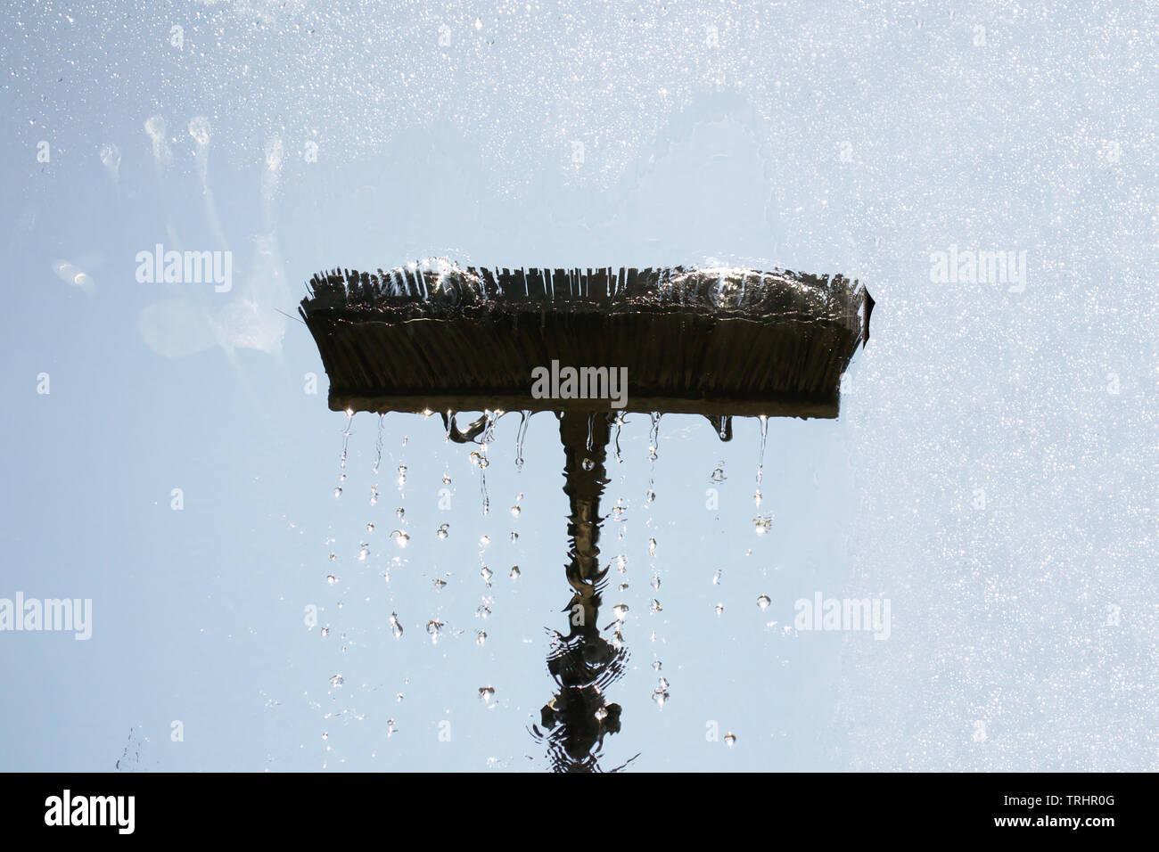 Window glass cleaning with pure water and extension pole. Washing and