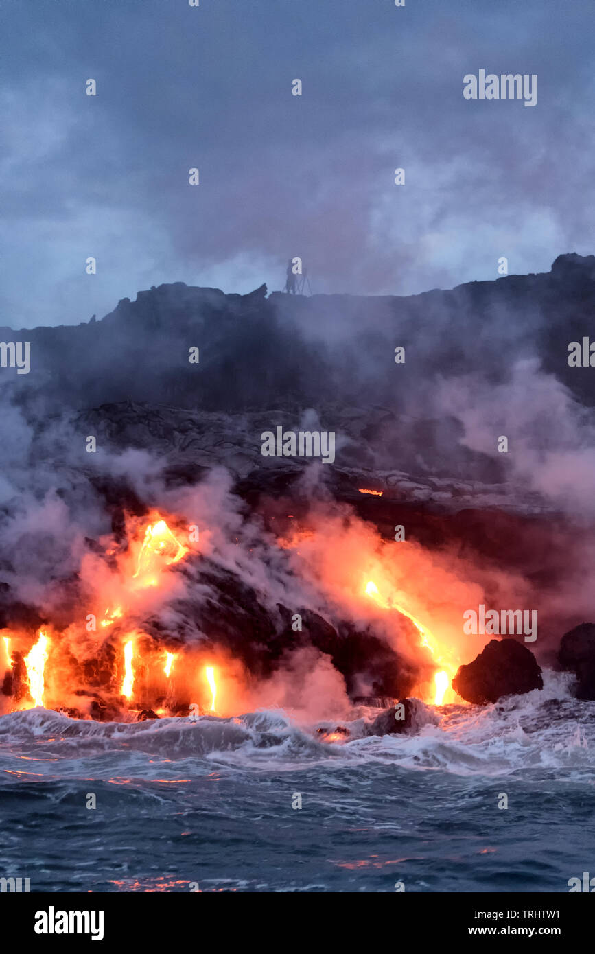 Molten lava flowing into the Pacific Ocean on Big Island of Hawaii Stock Photo