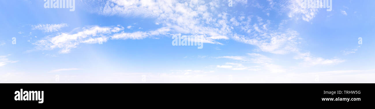 Bright blue cloudy sky at the horizon. Long panoramic view Stock Photo