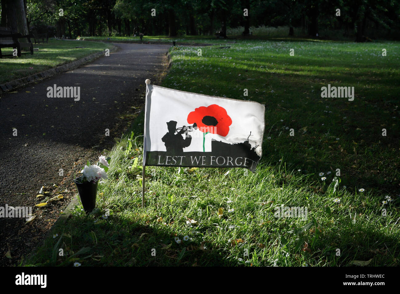 Lest we forget flag,ww1 poppy flag,  garden of remembrance in the UK Stock Photo