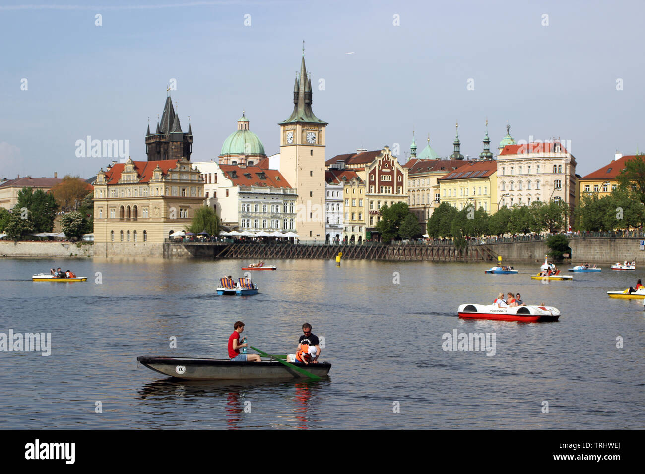 Paddle boats on Vltava River, Old Town on background, viewed from